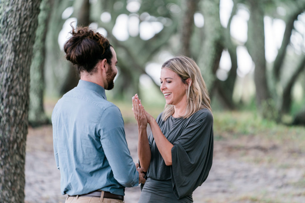 California couple travels to Wilmington, North Carolina and man surprises his girlfriend with a proposal at Fort Fisher in Kure Beach, North Carolina. Wilmington wedding photographers and destination wedding photographers capture the moment and love story.